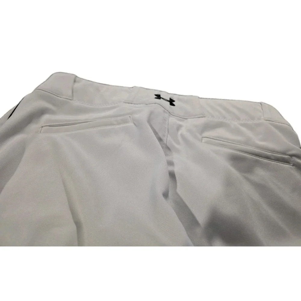 Under Armour branded inner waistband, tunnel belt loops, double snap closure. LG